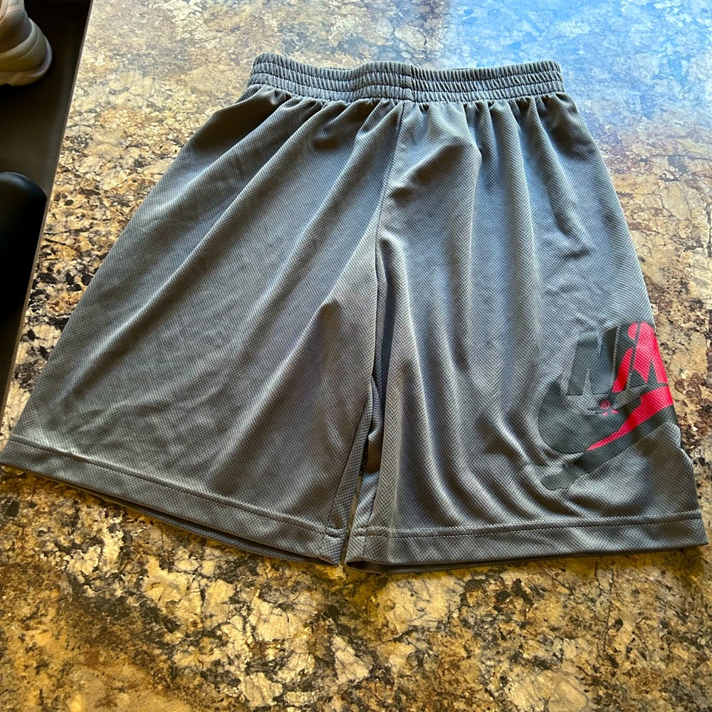 YOUTH NIKE AIR JORDAN SHORTS. SIZE LATGE 12-13 years old.  Gray
